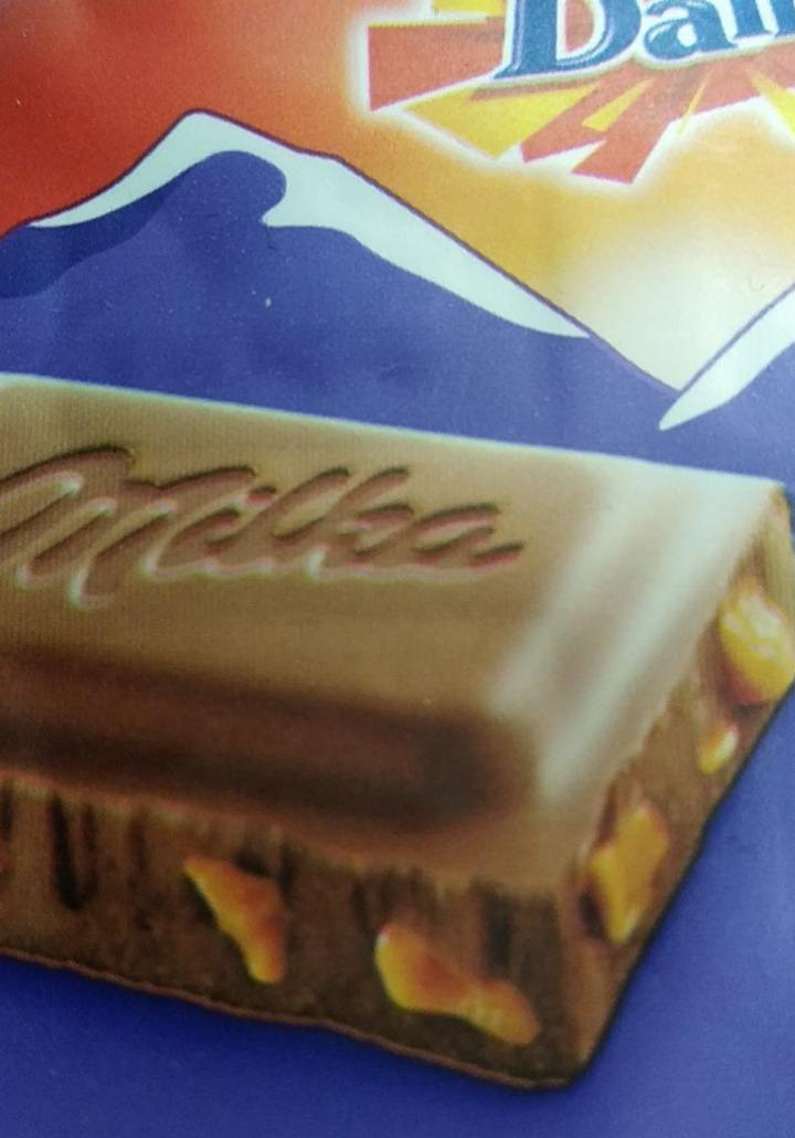 Фото - Шоколад молочный с кусочками хрустящей карамели с миндалем Milka