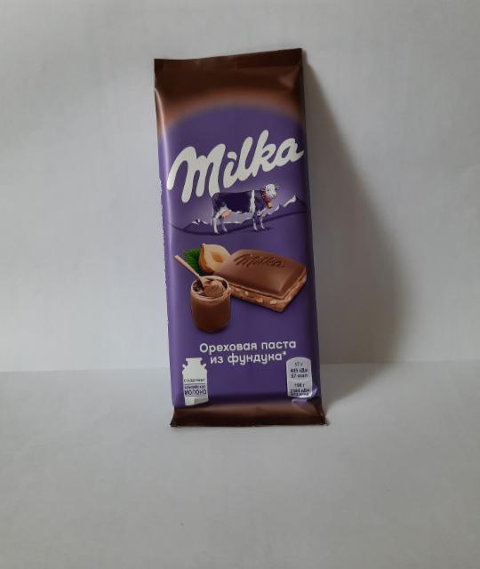 Фото - Шоколад молочный с начинкой из ореховой пасты из фундука и с дробленым фундуком Milka
