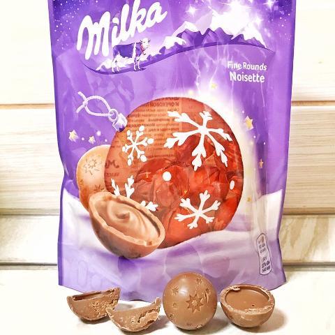 Фото - шоколад молочный Fine Rounds Noisette в форме шара с центром из молочного шоколада и ореховой пасты с фундука Milka