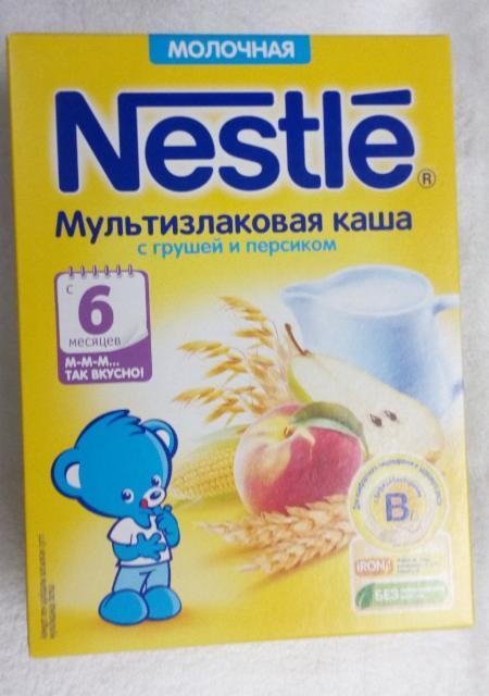 Фото - Каша Nestle мультизлаковая с грушей и персиком
