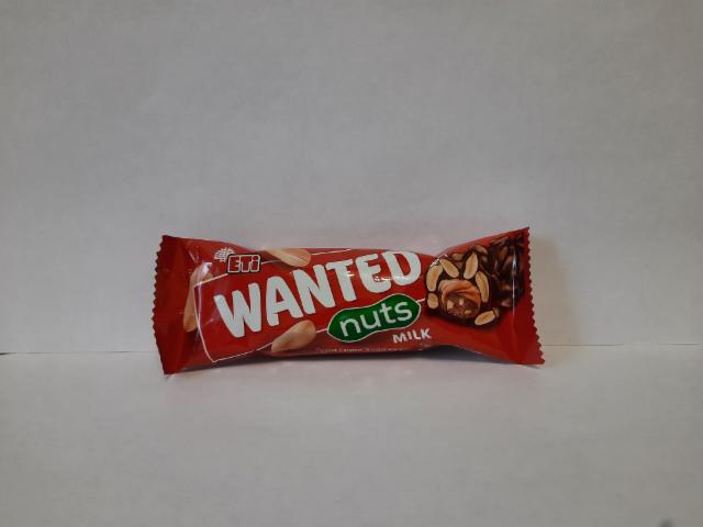 Фото - Батончик арахисово-карамельный с нугой в молочном шоколаде Wanted nuts Eti