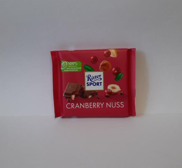 Фото - Шоколад молочный с кусочками клюквы и орехом лещины Cranberry Nuss Ritter sport