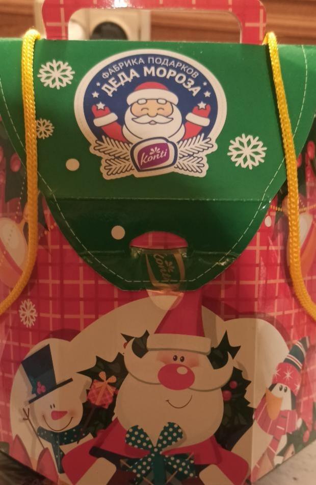Фото - Набор кондитерских изделий новогодний подарок в упаковке в виде рюкзачка-деда мороза Конти